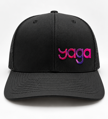 Black YAGA Signature Gradient Trucker Hat with pink and purple logo embroidery on the front panel.
